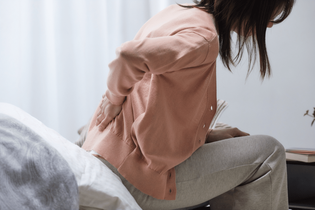 Lower back pain girl | Foundation Chiropractic